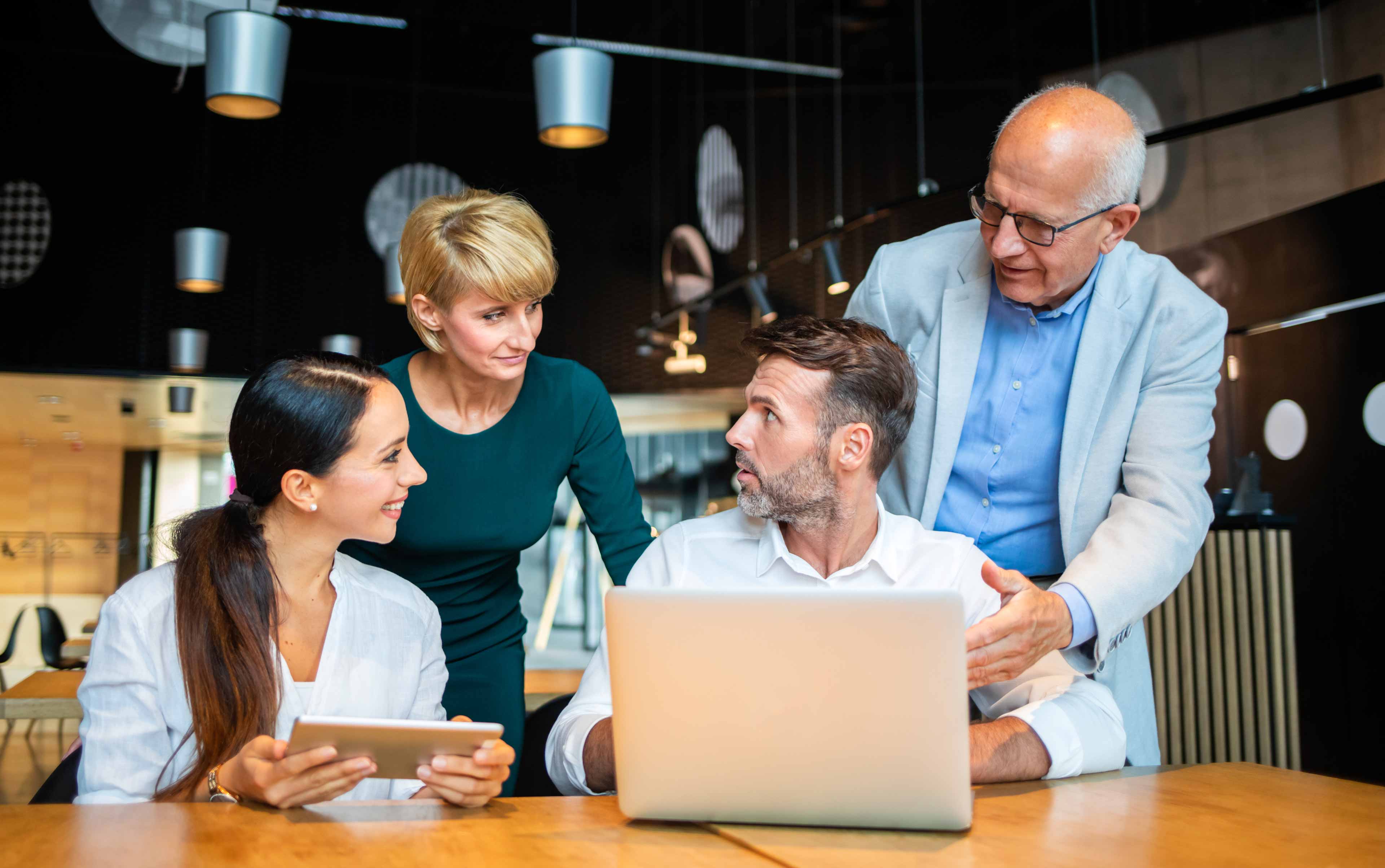 group of business people with laptop meeting