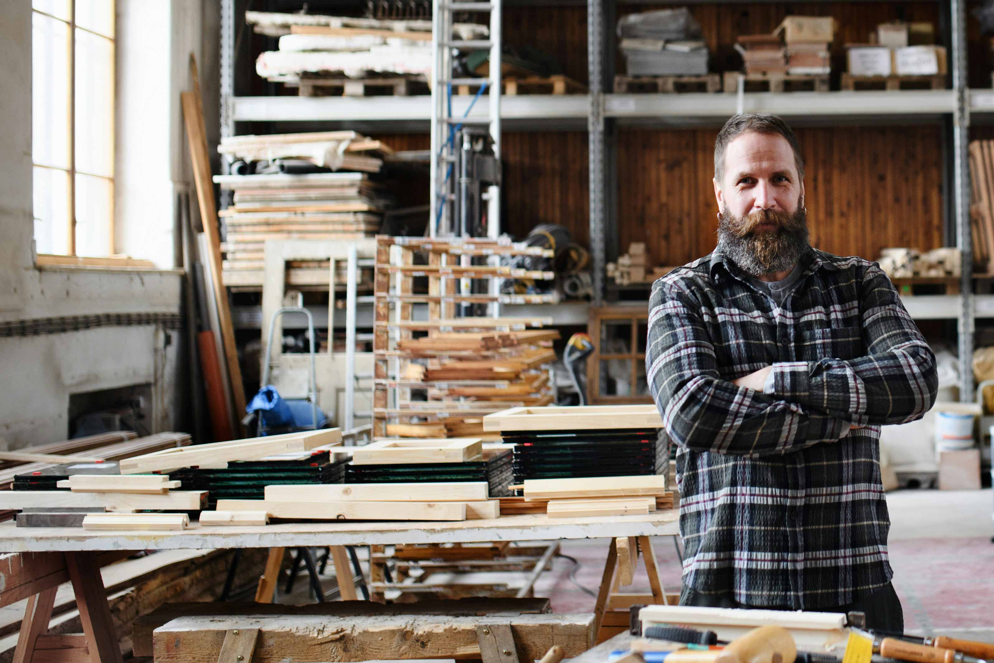 pdx tax client working in his workshop building furniture