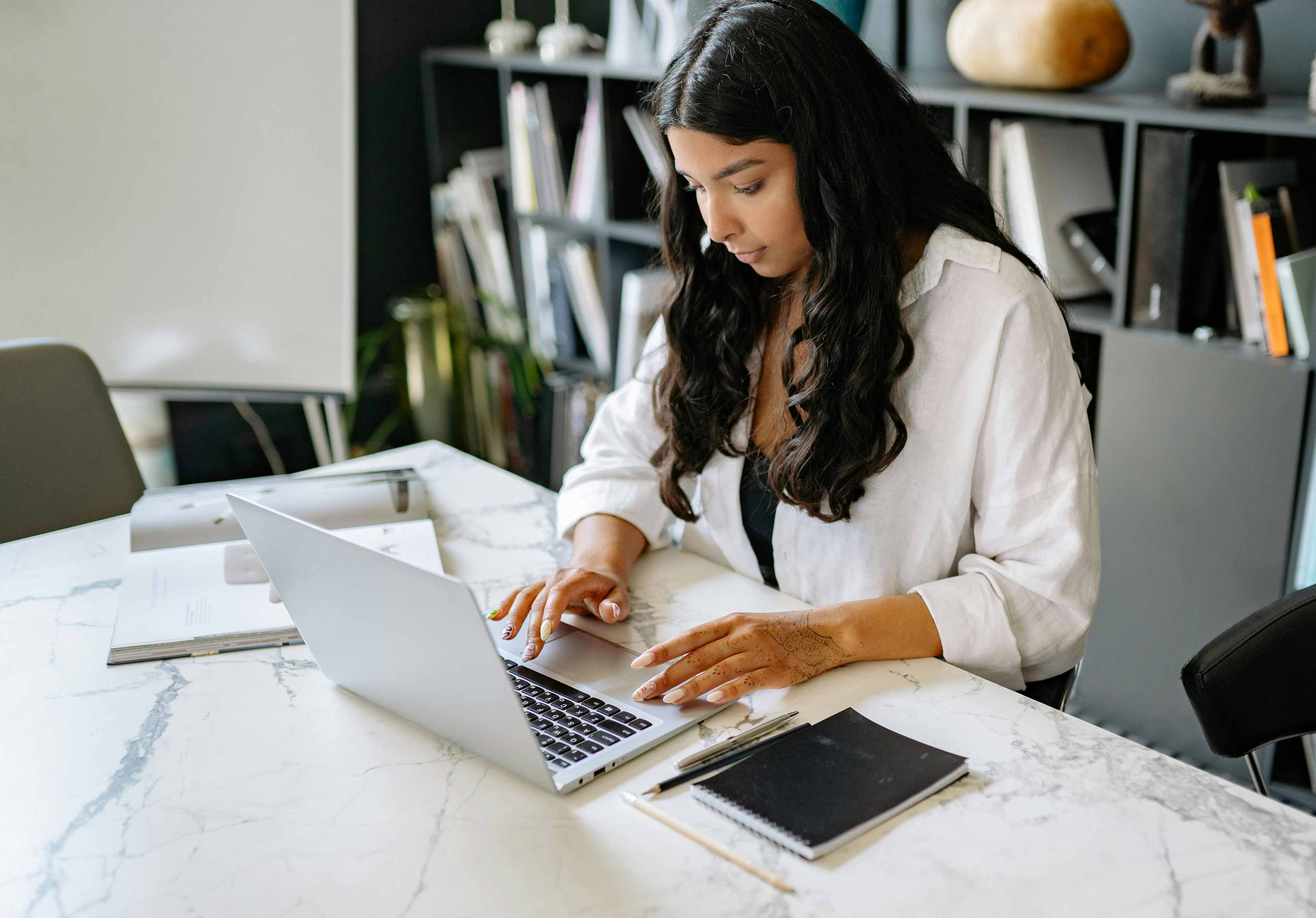 woman submitting her finance information to the pdx tax through the virtual platform